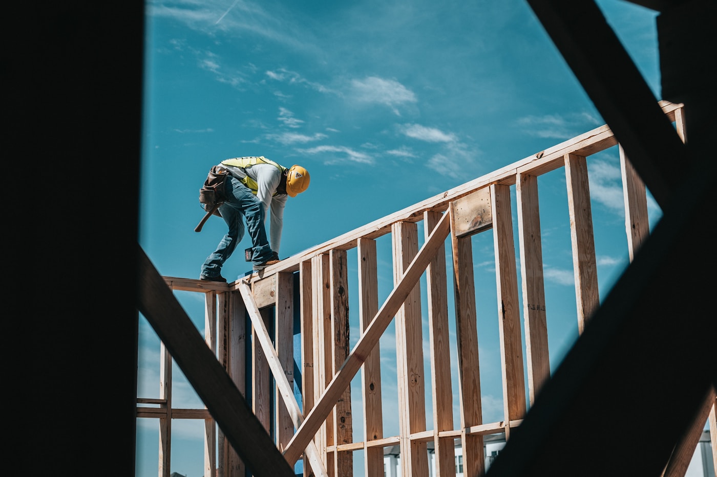 Pacific Lifestyle Homes crew framing a roofline on a custom home build